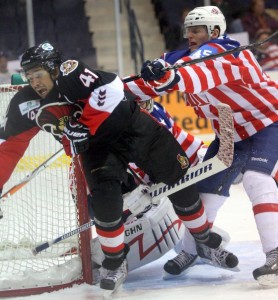 John de Gray knocks over Jonathan Cheechoo
